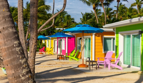 Colorful cabins and palm trees at La Siesta Resort and Marina, Florida